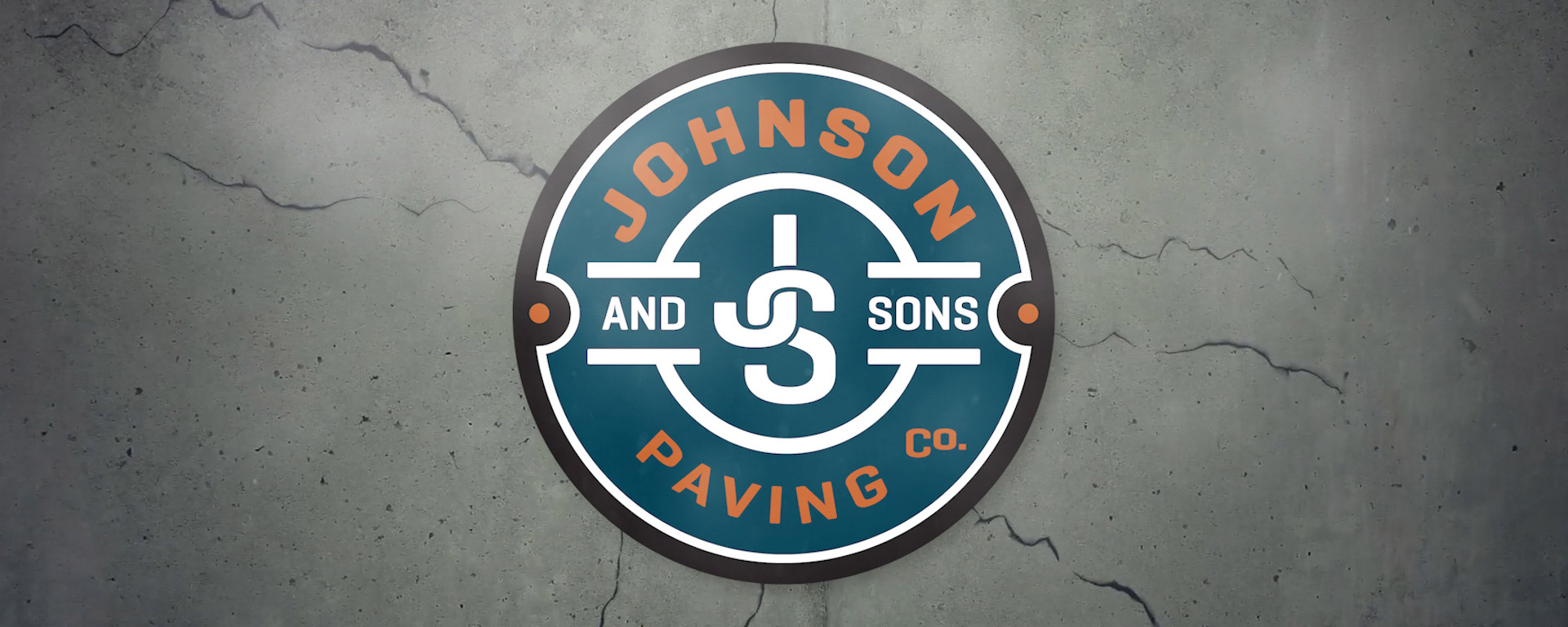 Johnson and Sons Logo on Asphalt Background Johnson and Sons Logo on Asphalt Background