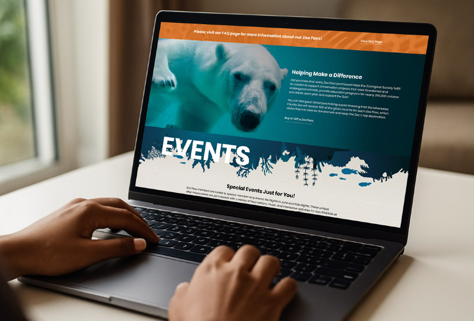 Zoo Society Events Page on a Laptop Screen